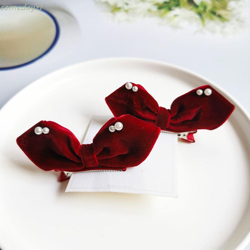 Set 2 kẹp tóc nơ bằng vải nhung đính ngọc trai nhân tạo màu trơn dễ thương đơn giản phong cách Hàn Quốc cho bé gái