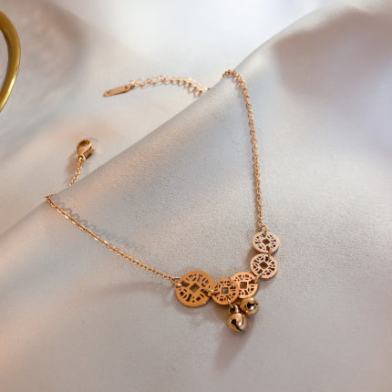 Lắc chân thép titan vàng 18K hình chuông may mắn