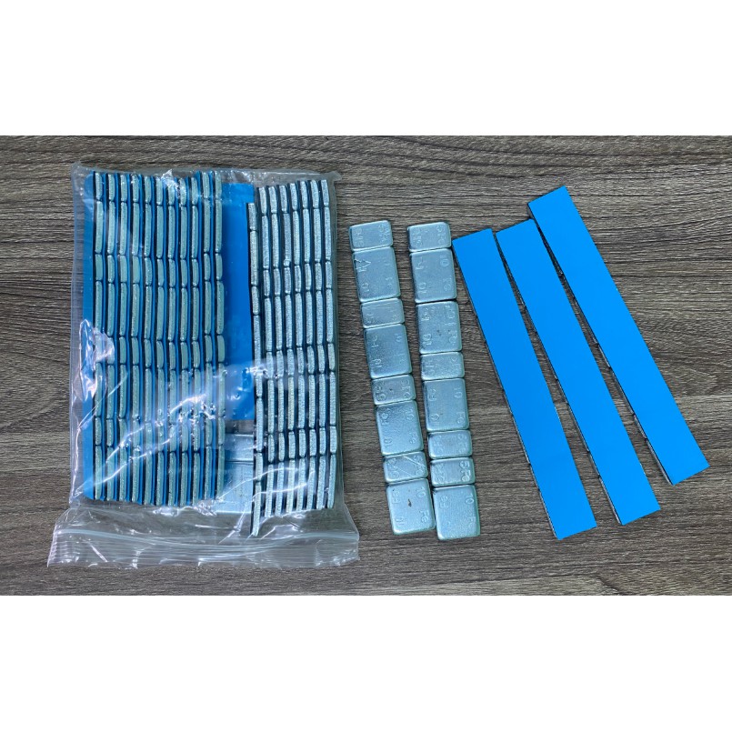 Chì dán cân mâm đóng hộp, băng keo có sẵn.