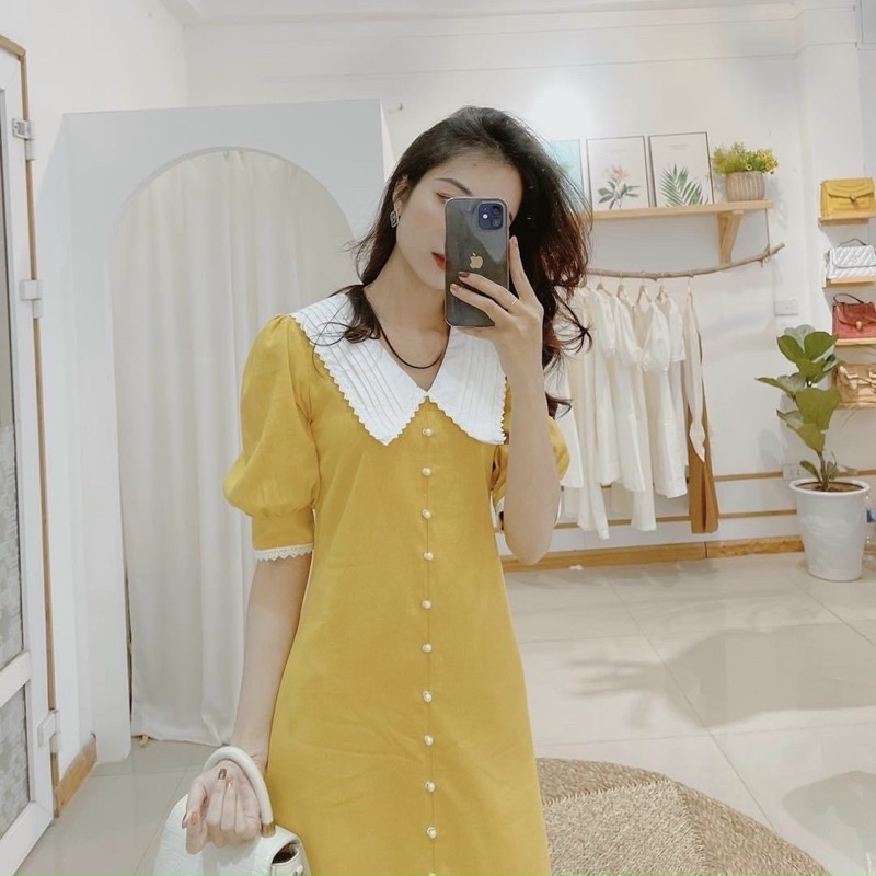 Đầm suông vàng phối trắng viền ren