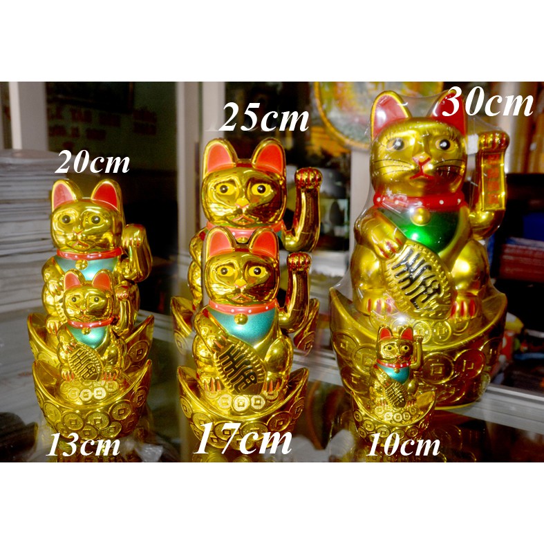 Mèo Thần Tài ngồi thỏi vàng vẫy khách chạy pin