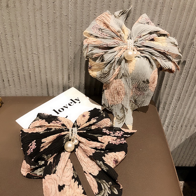 Kẹp tóc hình nơ đính hạt ngọc trai phong cách Hàn Quốc