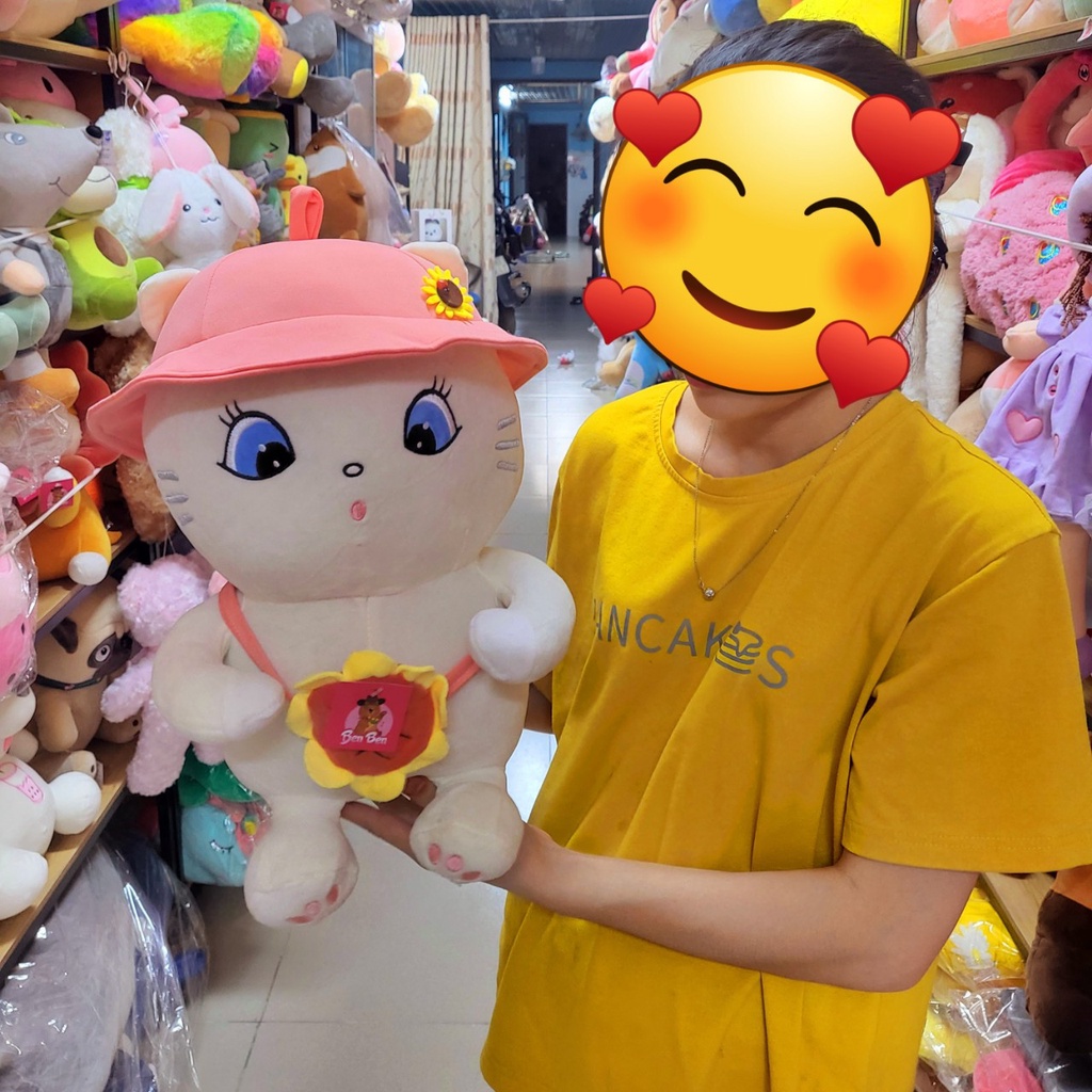 Gấu bông mèo lông xù cầm bơ
