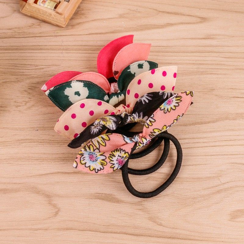 Dây cột tóc nơ hoa xinh xắn