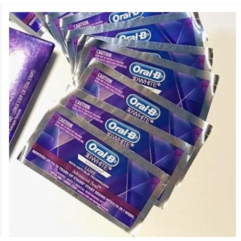 Miếng dán trắng Oral B màu tím không gây ê buốt răng