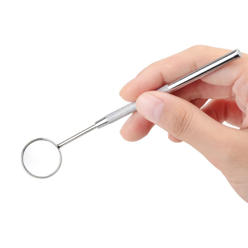 Một gương răng thép không gỉ để kiểm tra sự giãn nở lông mi bằng thiết bị in Mi-Press.