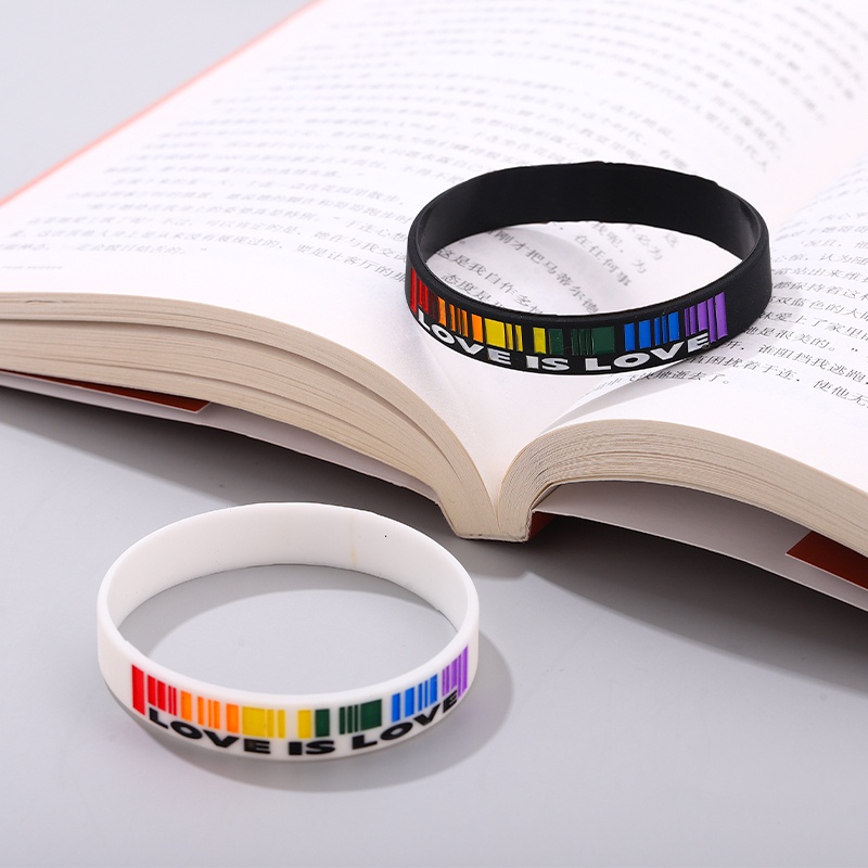 Vòng Tay Cặp Bằng Cao Su Mềm Màu Trắng Đen In Chữ LOVE IS LOVE