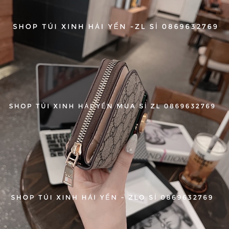 Ví dài cầm tay thời trang, tiện dụng lắp bấm logo hoạ tiến kể sọc giữ