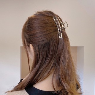 Kẹp gắp tóc kim loại hình da beo.