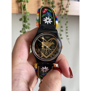 ĐỒNG HỒ NỮ SWISS SWATCH DÂY DA ĐEN HOA CÓ CHUÔNG CHÍNH HÃNG