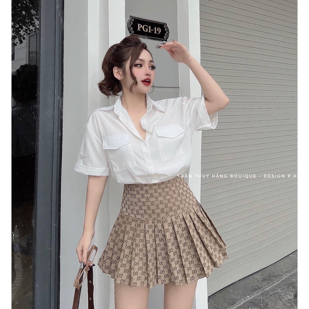 Chân váy xếp ly họa tiết có quần bảo hộ bên trong