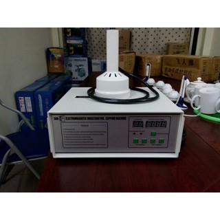 Máy dán màng seal chai lọ 500A