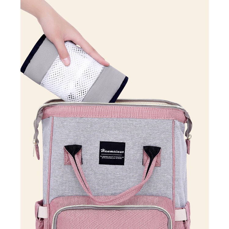 Địu em bé sơ sinh ngang hông phía trước một vai ôm sát người (tất yếu)