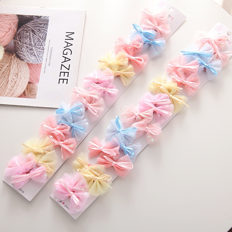 Kẹp tóc cho bé kiểu nơ hoạt hình