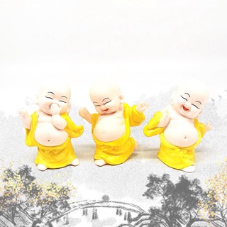 Tượng chú tiếu gốm sứ màu vàng phong thủy