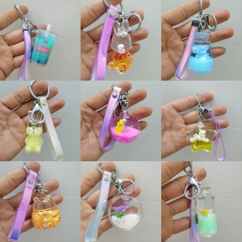 MÓC KHÓA NƯỚC DỄ THƯƠNG NHIỀU HÌNH HÀNG LOẠI 1 CÓ DÂY HOLOGRAM SÁNG BÓNG