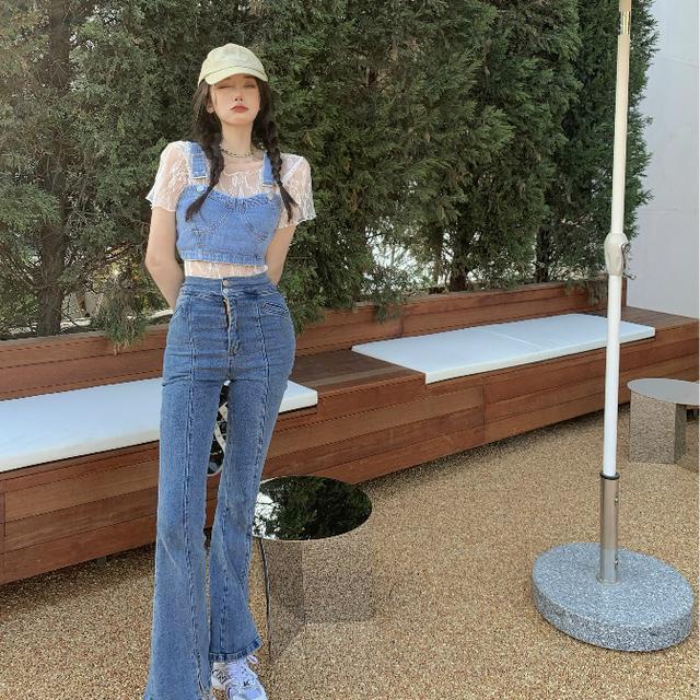 ' suit '- wear a short lace backed sleeveless top over a denim suspender vest