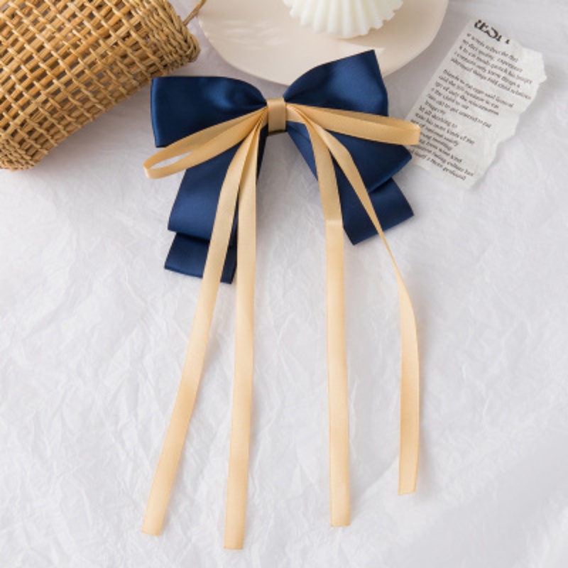 Kẹp tóc nơ nữ tính đơn giản và dễ thương