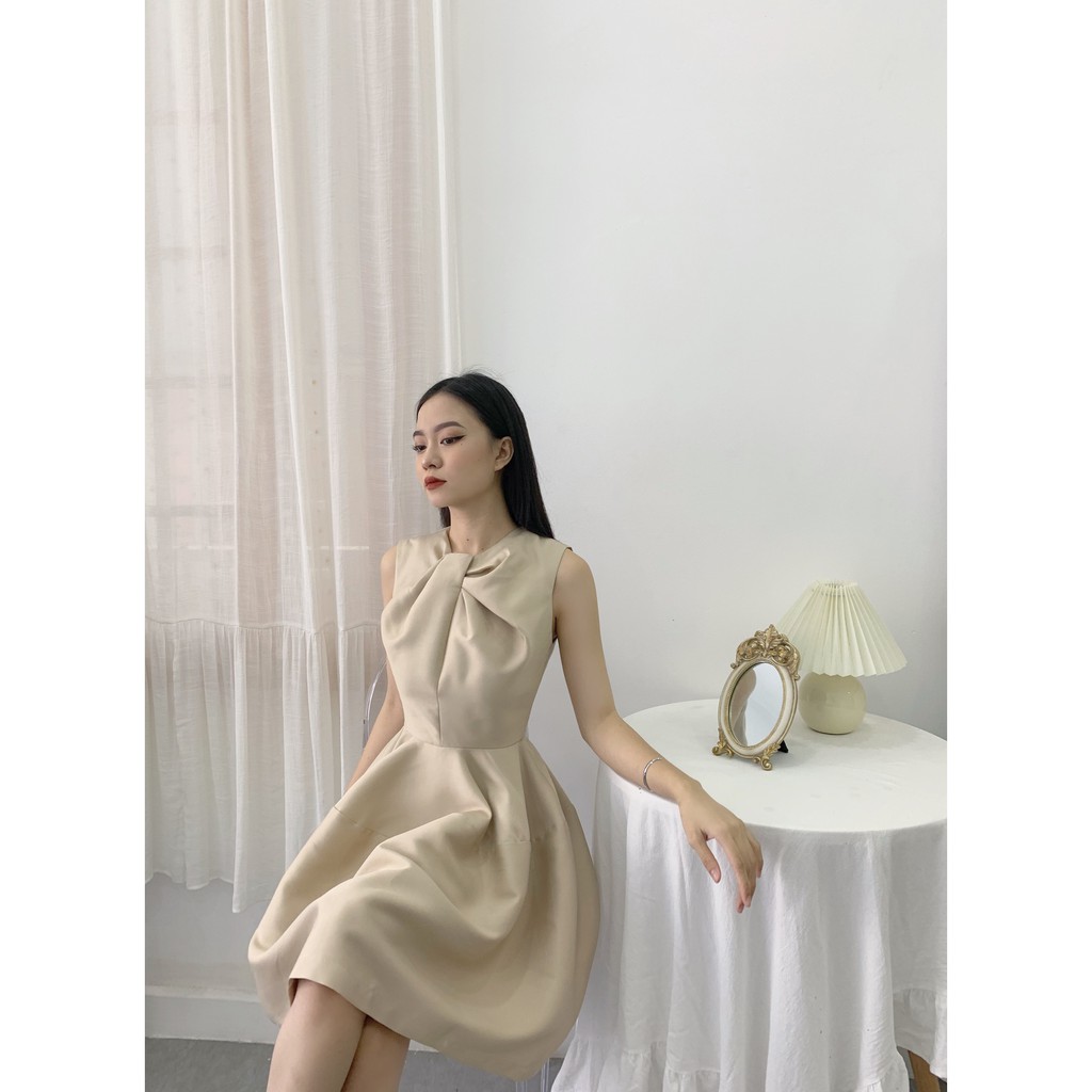 RECHIC Đầm Cổ Xoắn Xòe Không Tay Asma Màu Beige Hiện Đại Sang Trọng