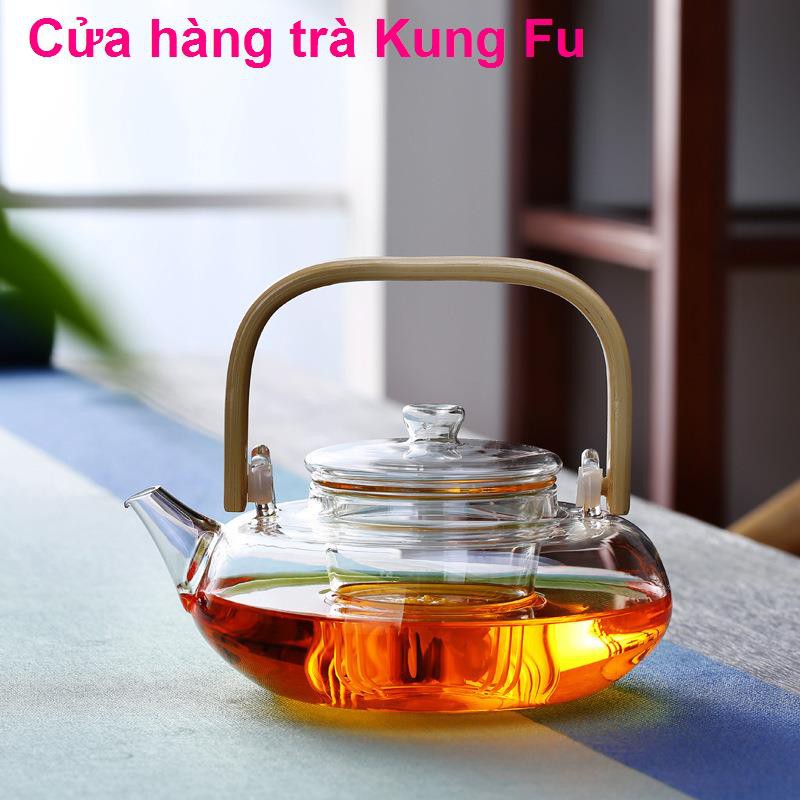 nhà sản xuất bán buôn ấm trà thủy tinh chịu nhiệt độ cao đun sôi dày tay cầm bằng tre thơm Bộ gia dụng