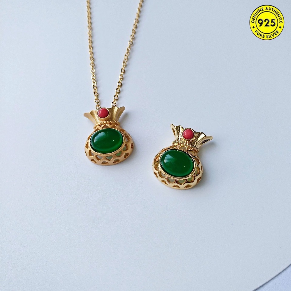 Dây chuyền may mắn hình túi xách đính ngọc lục bảo