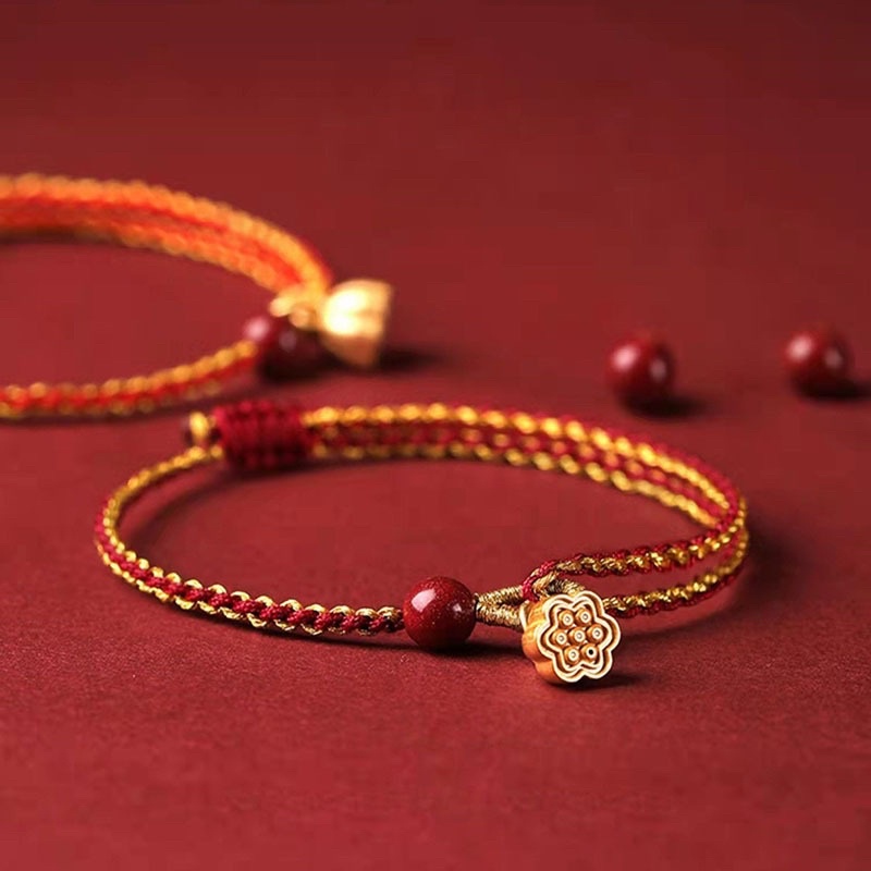 Vòng tay dây tết đỏ charm sen