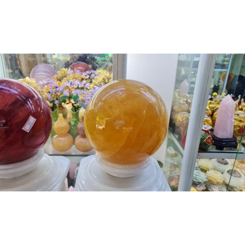 Quả bi cầu phong thủy canxit vàng từ 6cm đến 20cm tặng đế gỗ đẹp