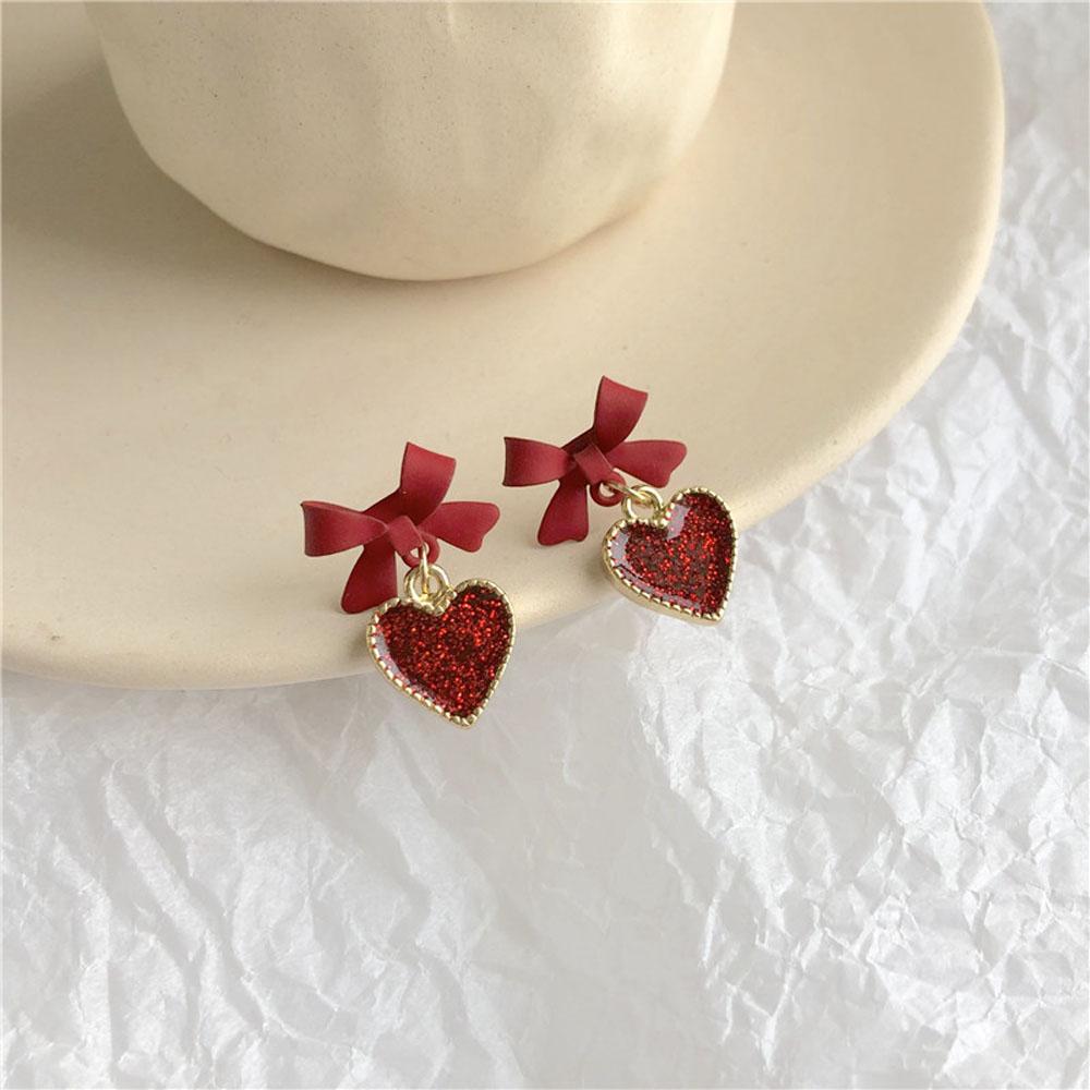 Bông tai hình trái tim đỏ đính nơ nhỏ dễ thương