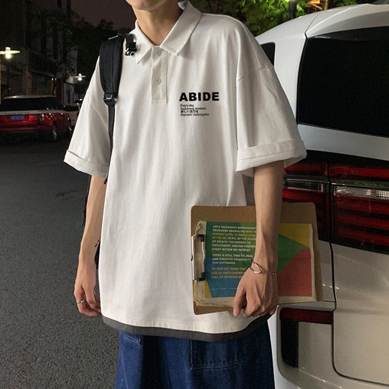 Áo Polo Nam Nữ Form Rộng Chất Thun Mềm Mát Phong Cách In Chữ Cái Cool Hợp Thời Trang Bắt Kịp Xu Hướng TTQ0333