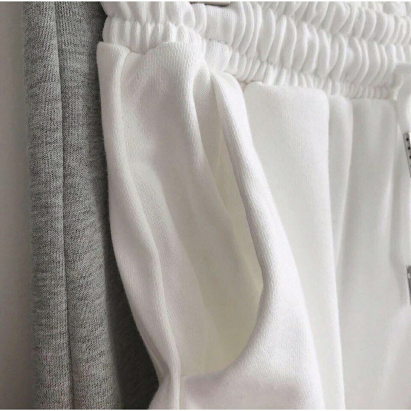Quần jogger bo gấu thêu spur unisex chất liệu da cá năng đông