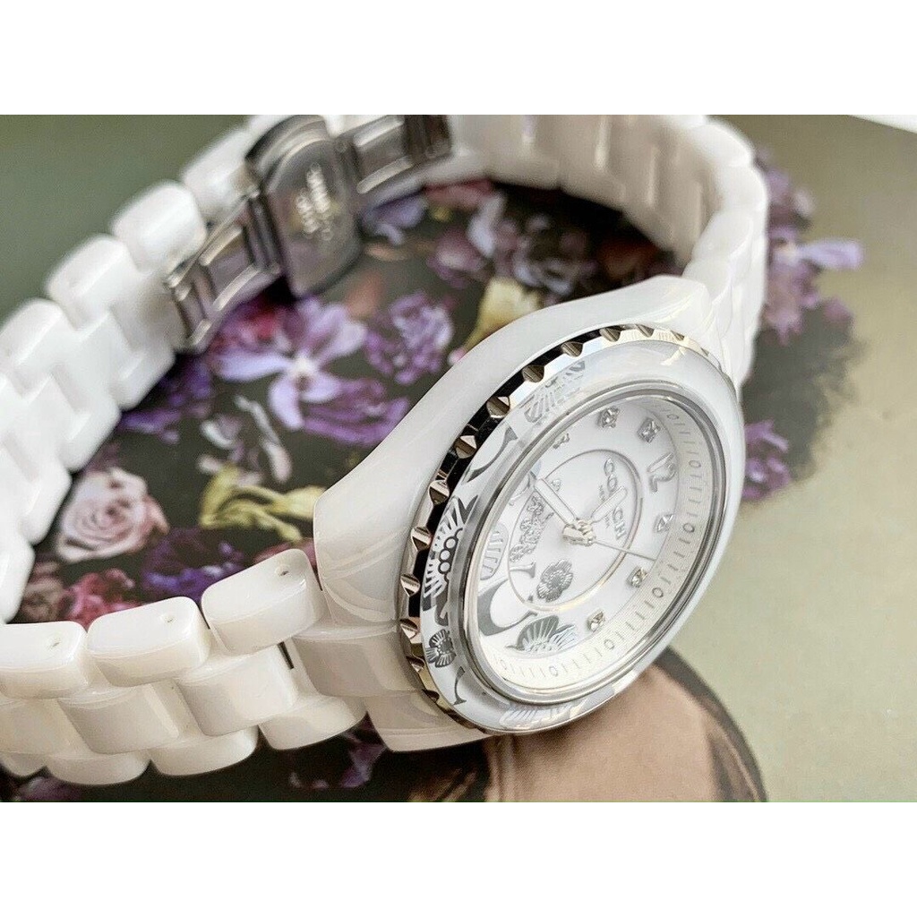 Đồng Hồ Nữ Coach Dây Đá Ceramic Trắng Nền Hoa Văn Nổi 32mm
