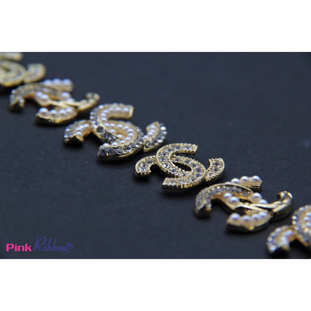 Charm chữ X trai nhí màu vàng gold-3 mẫu