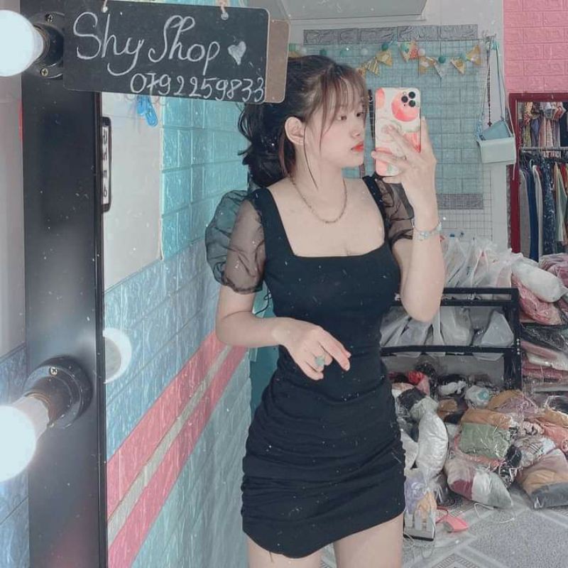 Đầm body nhún tay phối lưới.