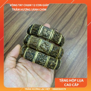 Vòng tay trầm hương sánh chìm 12 con giáp cao cấp bọc vàng