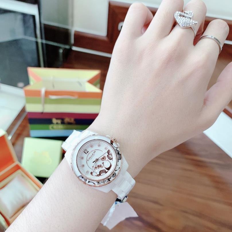 Đồng Hồ Nữ Coach Dây Đá Ceramic Trắng Vỏ Vàng Hồng - Nền Hoa Văn Nổi - 32mm