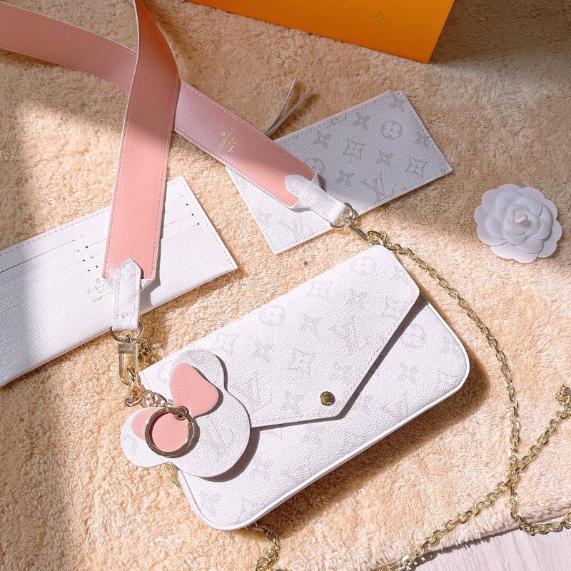 túi đeo chéo dáng ví ngang dài khoá cúc da in logo louis vuitton LV