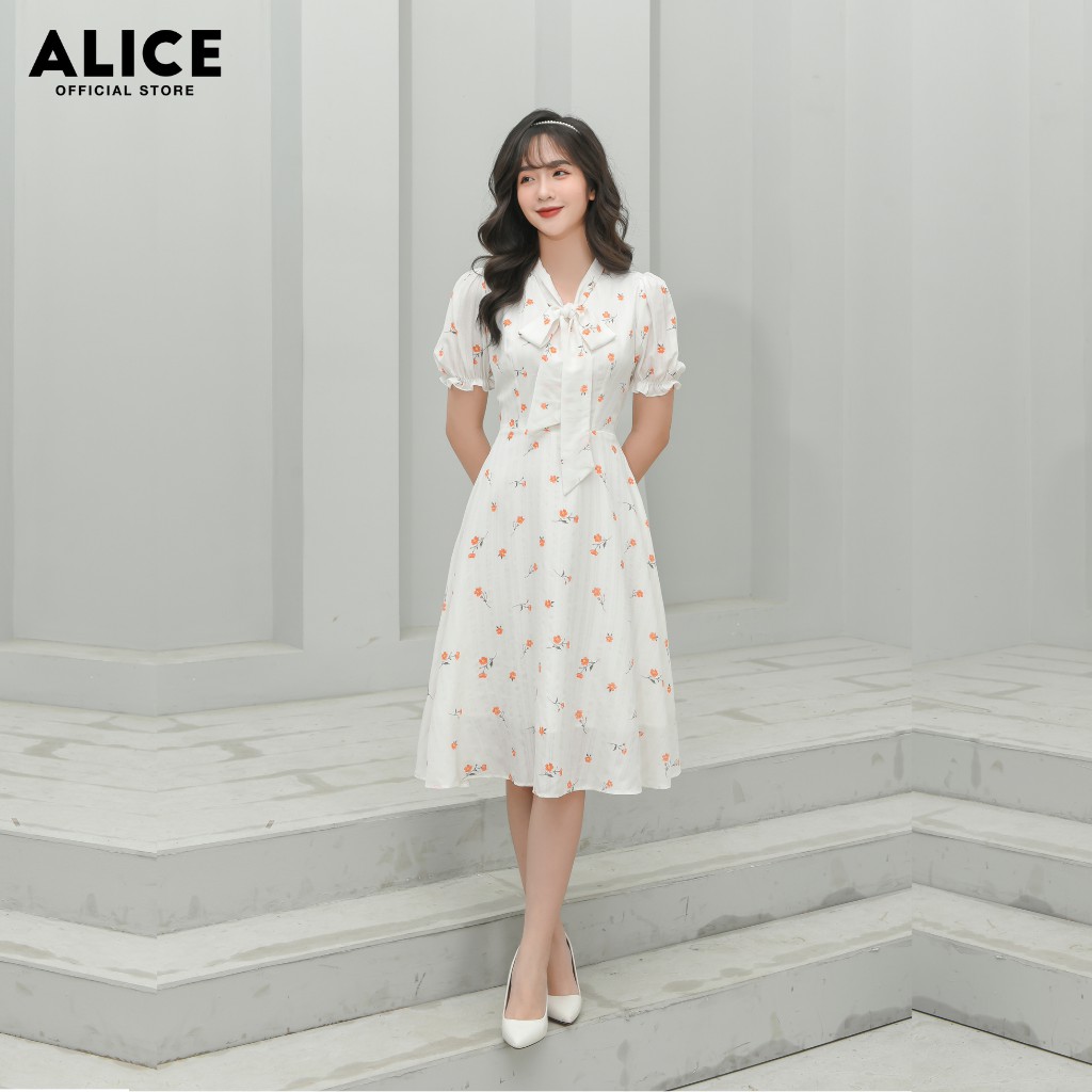 Đầm Trắng Thiết Kế Đẹp ALICE Dáng Xòe Cổ Chữ V Thắt Nơ Tay Bồng Chun Gấu Tay Họa Tiết Hoa Nhí V684 | BigBuy360 - bigbuy360.vn