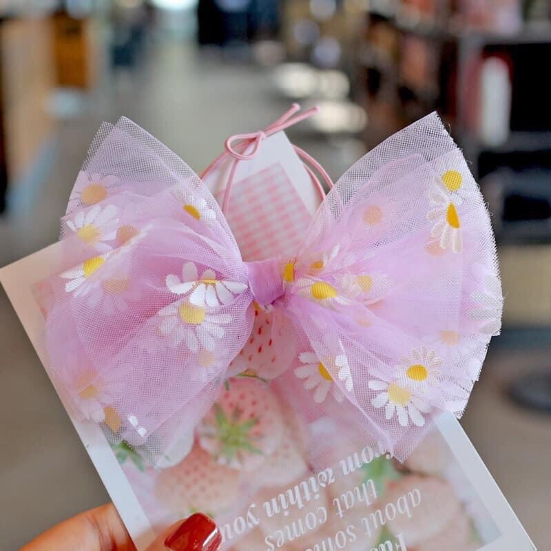 Kẹp tóc bé gái nơ voan hoạ tiết hoa cúc vàng