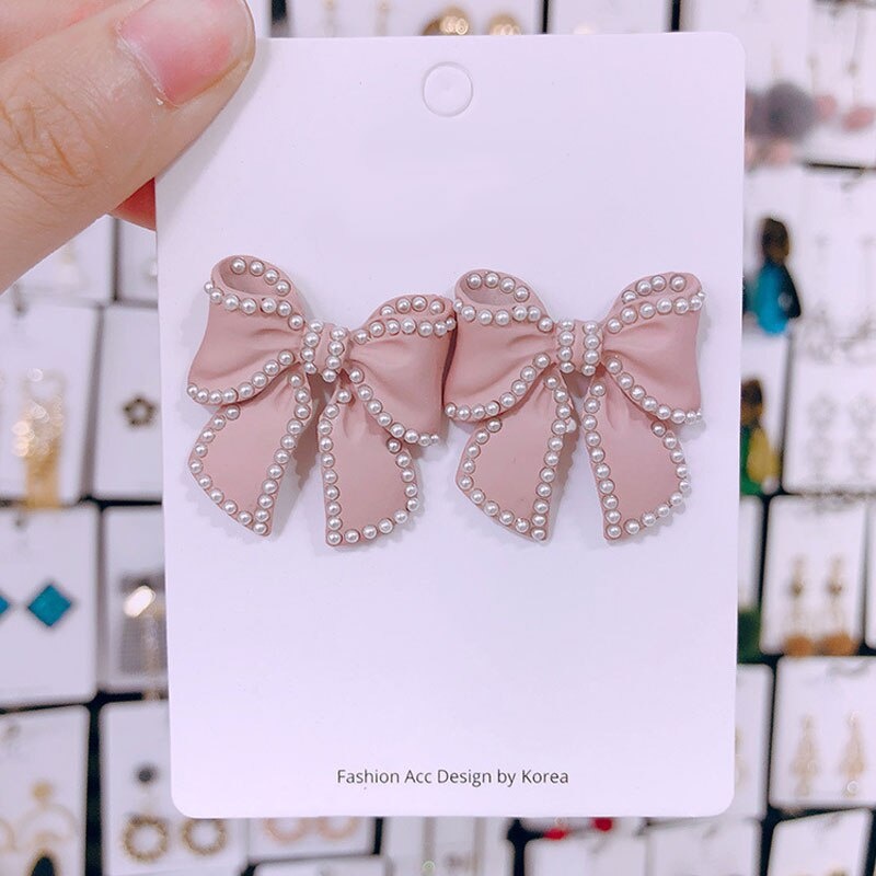 Đôi khuyên tai hình nơ đính ngọc trai giả thời trang cho nữ