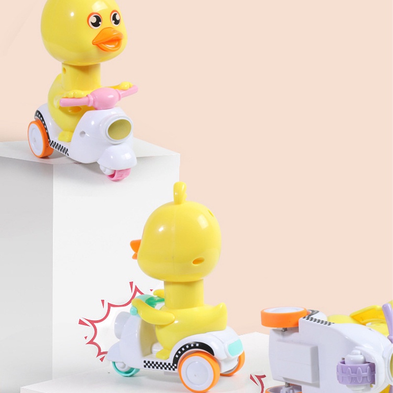 Đồ Chơi Chú Vịt Vàng Hoạt Hình Lái Xe Máy Dễ Thương Cho Bé