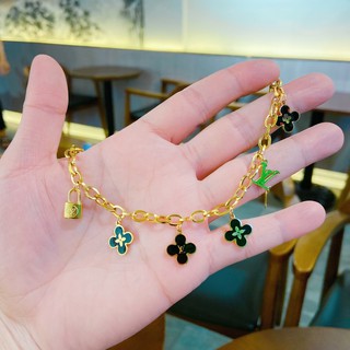 Lắc tay titan Lv mạ vàng ko đen