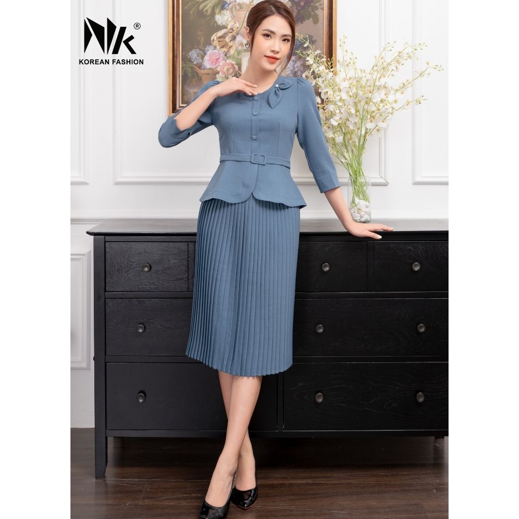 Bộ Vest Nữ Công Sở NK Fashion Áo Dáng Peplum Cổ Nơ Kết Hợp Chân Váy Xòe Dập Ly, Chất Vải Nhập Hàn NKFBD2109021