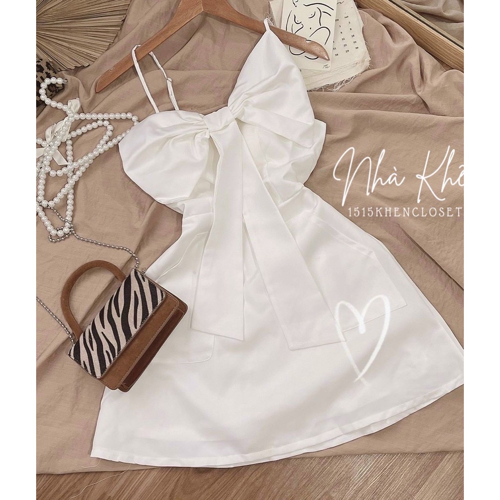 Đầm 2 dây mini trắng nơ ngực to