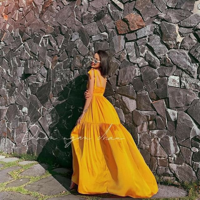 Đầm maxi vàng tầng cột nơ vai Vnxk