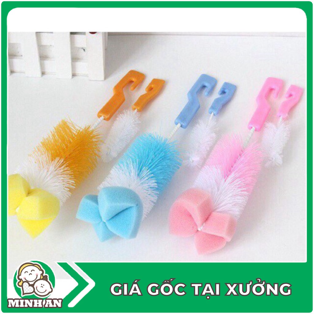 cây cọ rửa bình sữa và núm ti . .
