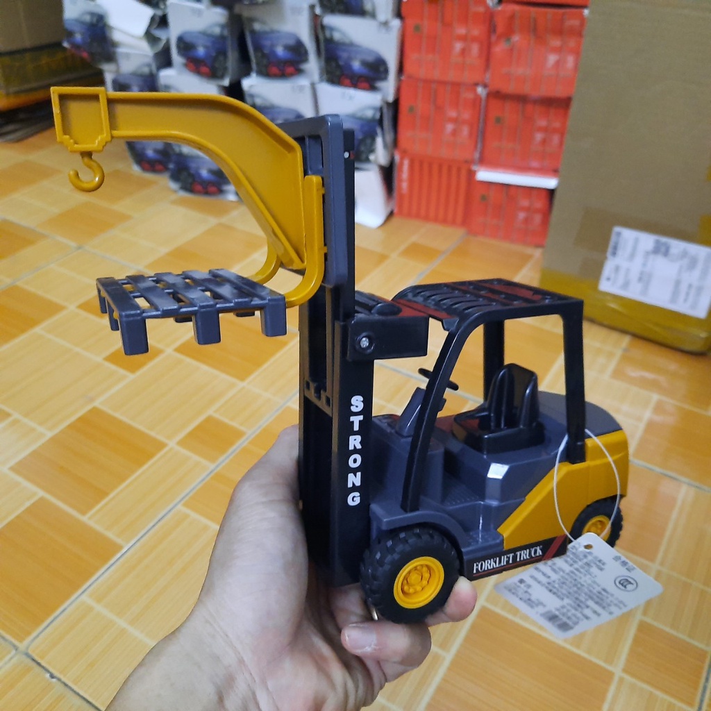 Xe nâng đồ chơi trẻ em bằng nhựa chạy đẩy trớn bằng bánh đà có giá nâng lên được