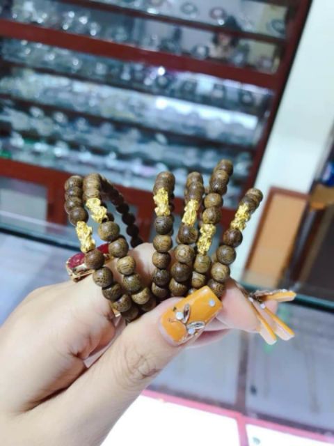 Vòng tay trầm hương tỳ hưu vàng 6mm