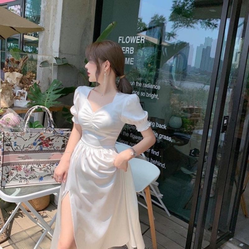 Đầm trắng nhún tay phồng xẻ tà 2 màu trắng, đen sang trọng