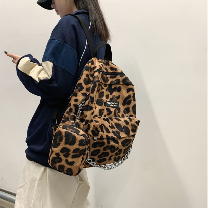 Balo unisex đi học, đi chơi họa tiết bò sữa Leopard phối dây xích cực ngầu KÈM túi đựng đa năng độc lạ