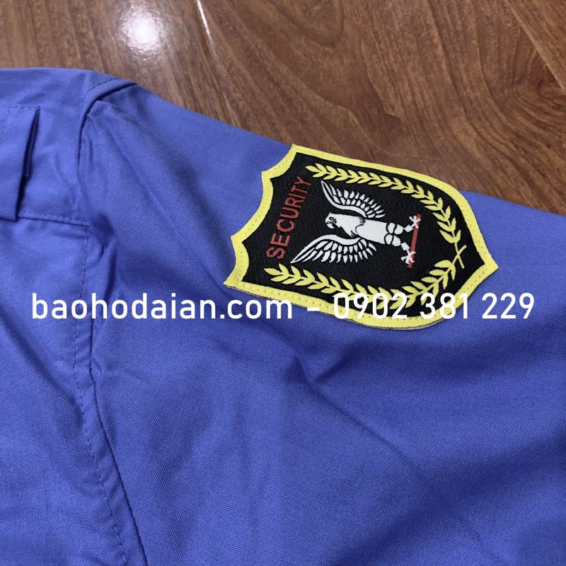 Áo bảo vệ vải Kate Mỹ tay dài màu xanh nước biển logo tay